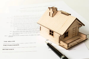 Pen beside property purchase agreement