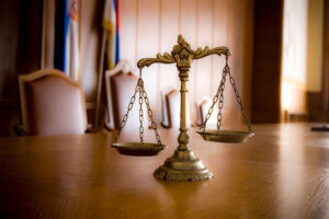 Antique courtroom scales on wooden table